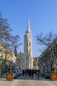 Budapest, HUNGARY - FEBRUARY 15, 2015 - Street with tower of St. Matthias Church in Budapest, Hungary