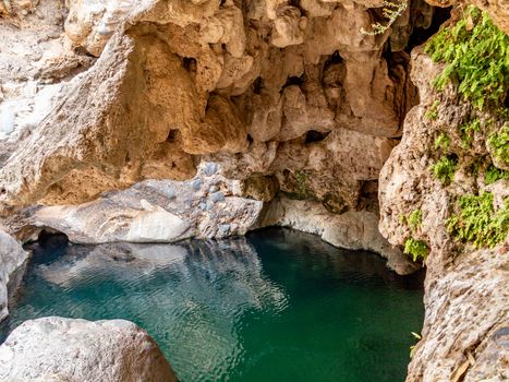 Lagoon in a cave in Wadi near Muscat, Oman.