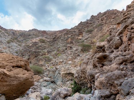 Parched riverbed called wadi in Asia, in the outskirts of Muscat, Oman.
