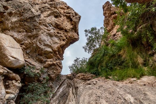 narrow gorge between the rocks on the wadi footpath in the vicinity of Muscat, Oman.