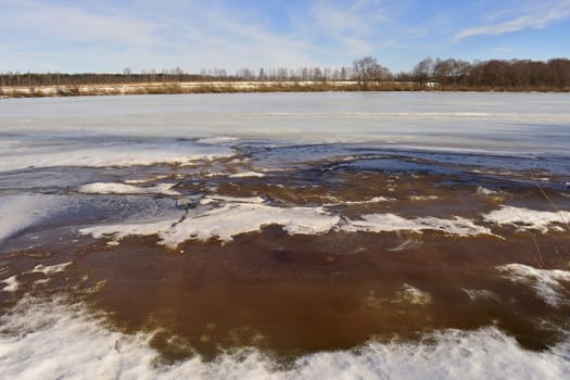 river in early spring, the ice begins to melt