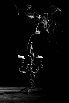 candlestick with extinct candles, black and white image