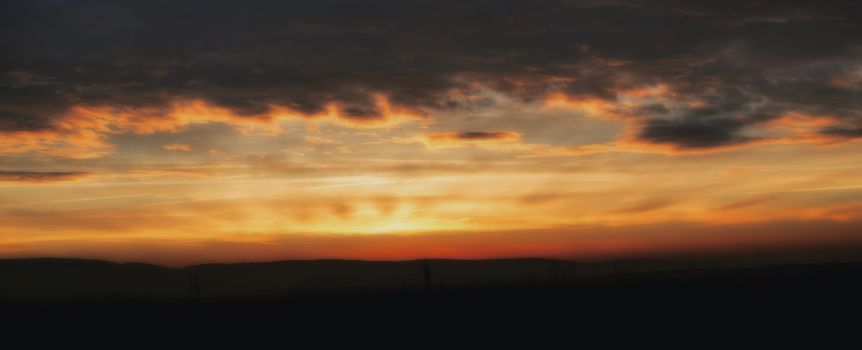 Romantic sunrise with dramatic sky and clouds