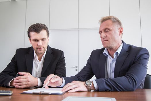 Business men Signing Contract at meeting close up view