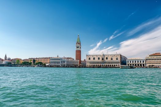 St Mark's Square in Venice, Italy, Piazza San Marco in Venezia with bell tower and the Doge's Palace from the sea, vivid bright colors