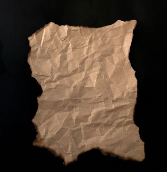 burnt paper sheet isolated on black background
