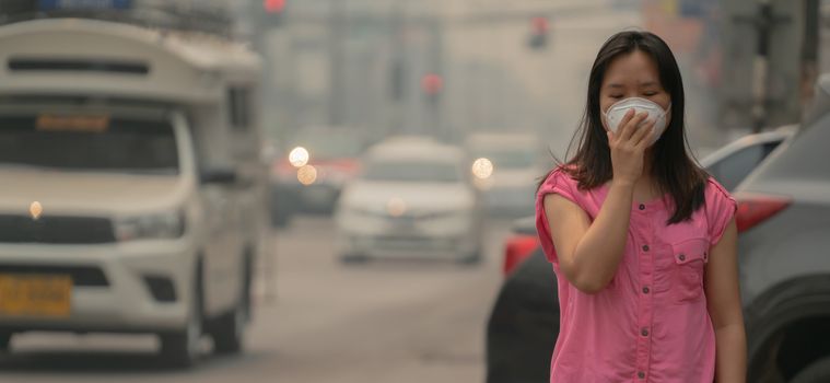 Young woman wearing protective mask in the city street, chiang mai thailand