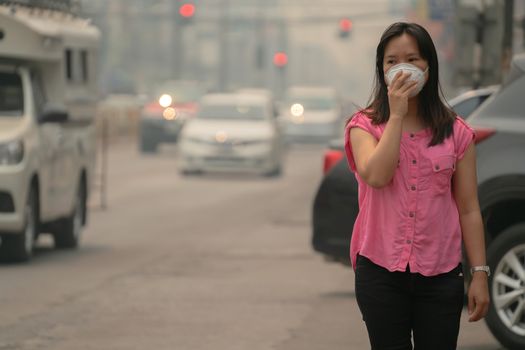 Young woman wearing protective mask in the city street, chiang mai thailand