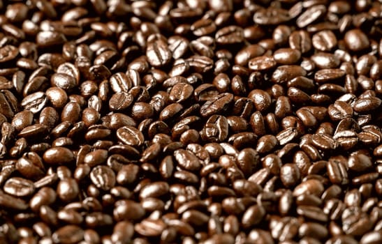 Roasted coffee beans on a flat background textured