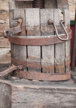 A historic wooden bucket with an iron ring