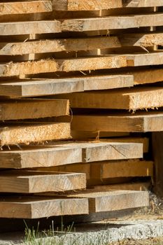 Stacked wooden boards are waiting for processing