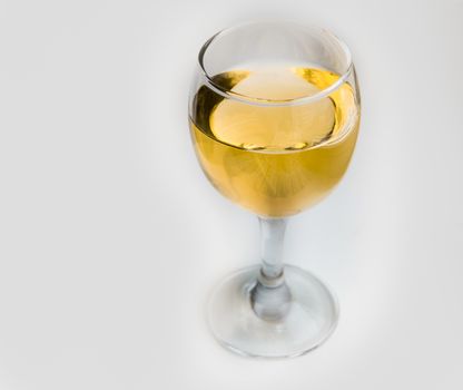 White wine in glass glass on white background.