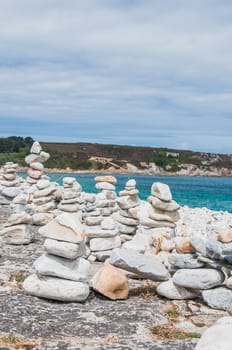 Pebbles in balance near Notre Dame de Rocamadour in Camaret-sur-mer in Finistère, Brittany, France