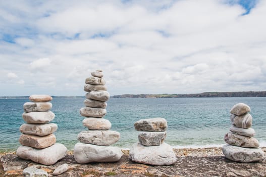 Pebbles in balance near Notre Dame de Rocamadour in Camaret-sur-mer in Finistère, Brittany, France