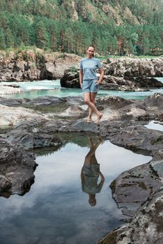 Woman at river in Altai Mountains territory