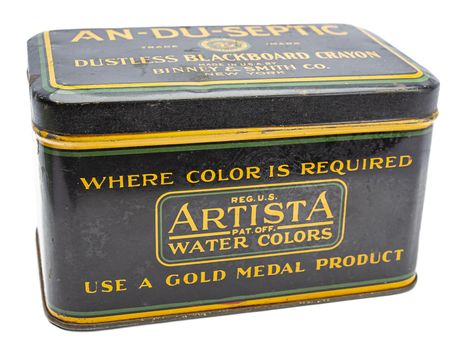 Isolated vintage metal black box of crayon