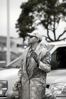 San Francisco, CA, USA - September 25, 2011: City street performance of silver painted actor. San Francisco, USA