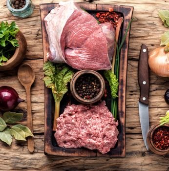 Fresh raw minced beef ground beef on wood background