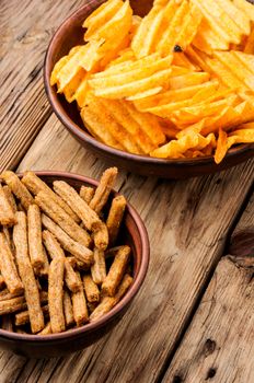 Crispy potato chips in bowl.Homemade potato chips