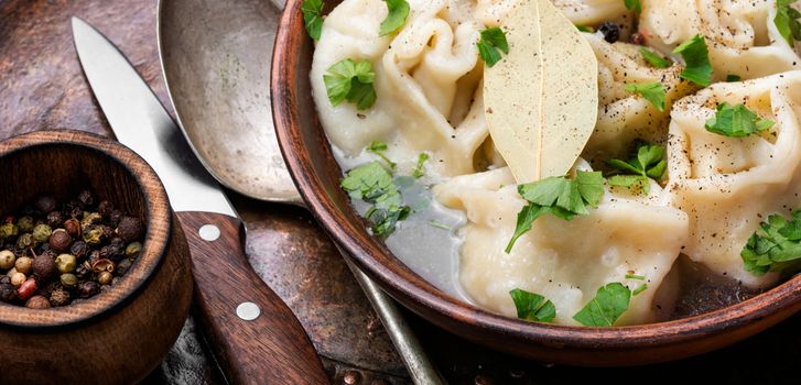 Delicious dumplings in the bowl on the table.Chinese dumplings for dinner