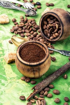 Roasted coffee beans and ground coffee.Coffee on green background