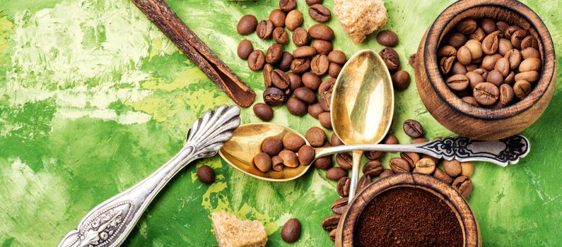 Roasted coffee beans and ground coffee.Coffee on green background