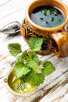 Cup of healthy herbal tea with nettle.Nettle tea