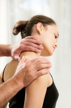 The young woman on reception manual therapy. Osteopathy, manual therapy, acupressure. Alternative medicine, pain relief concept. Rehabilitation after sport Injury, Physical therapy.