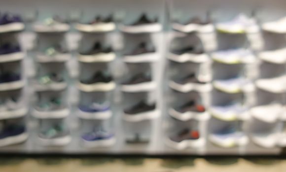 defocus shot of shoes on shelf in the store 