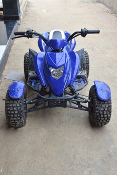 blue ATV motorcycle beach