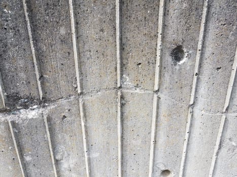 worn or weathered grey cement wall with scratch or damage