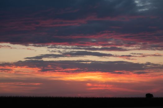 Romantic sunset with black silhouette in the foreground