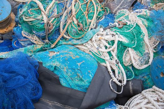 A big pile of nets, ropes and fishing accessories