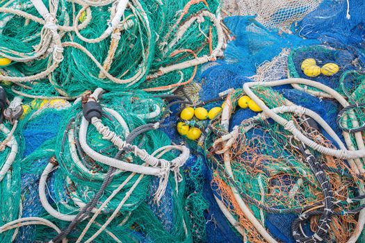 A big pile of nets, ropes and fishing accessories