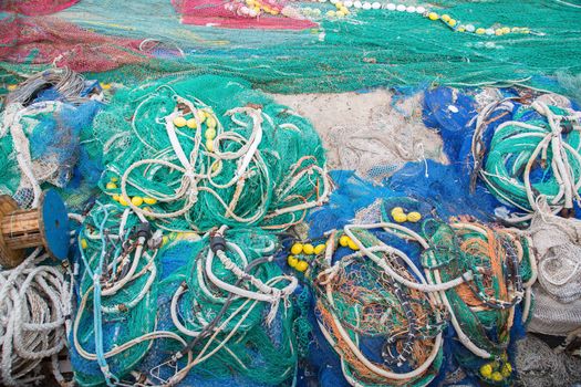 A big pile of nets, ropes and fishing accessories