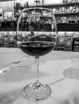 Black White Photography Of Two Glasses Of Wine In A Luxury Restaurant