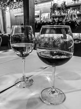 Black White Photography Of Two Glasses Of Wine In A Luxury Restaurant