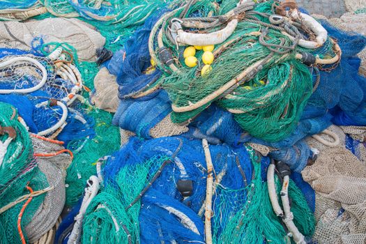 A big pile of nets, ropes and fishing accessories