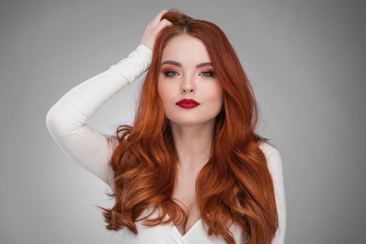 Portrait of young woman with long beautiful ginger hair