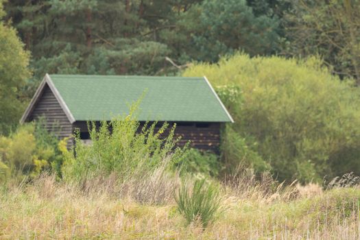 Small wooden hut in the middle of the wilderness