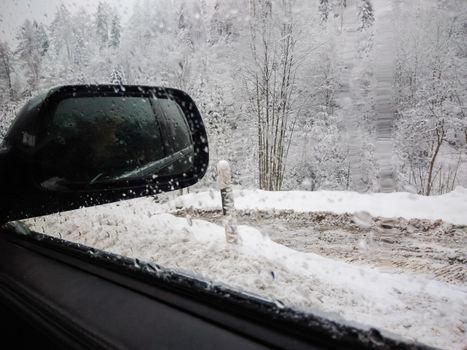 An exterior mirror of a car in winter