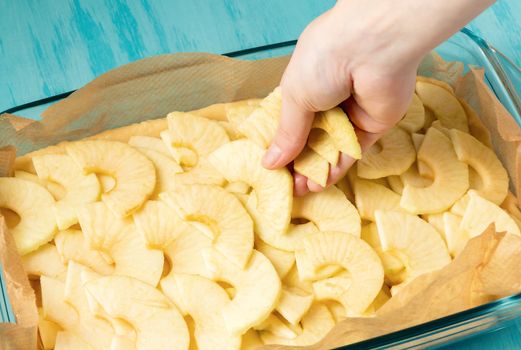 Putting apples on the dough in a baking dish. Cooking Apple Pie - photo, image.