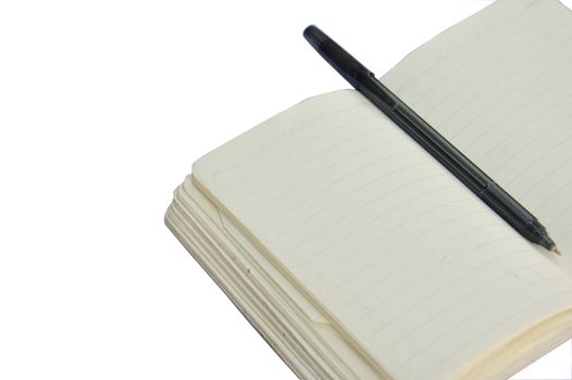 white book with ballpoint