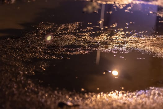 there is a pond at road with warm lightning. photo has taken at izmir turkey.