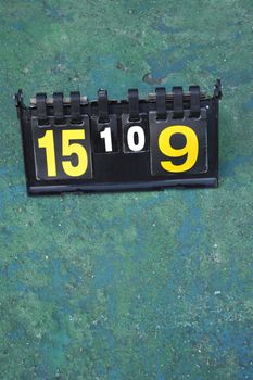 volleyball scoreboard on the cement floor