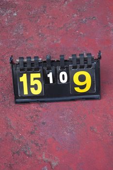 volleyball scoreboard on the cement floor