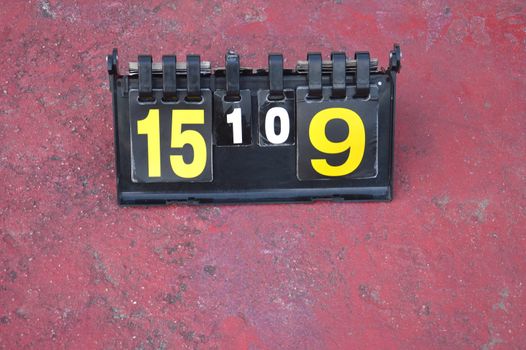 volleyball scoreboard on the cement floor