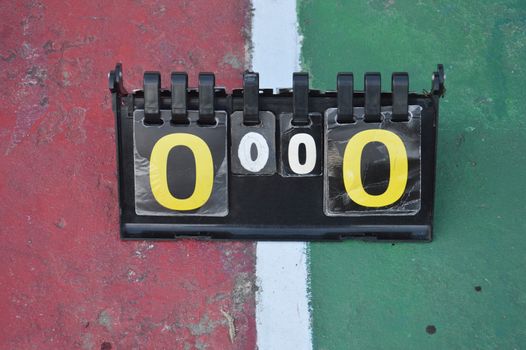 volleyball scoreboard on the cement floor