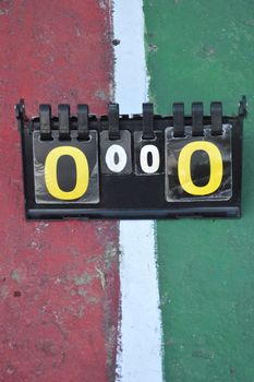 volleyball scoreboard on the cement floor