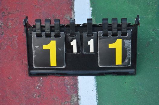 volleyball scoreboard on the cement floor